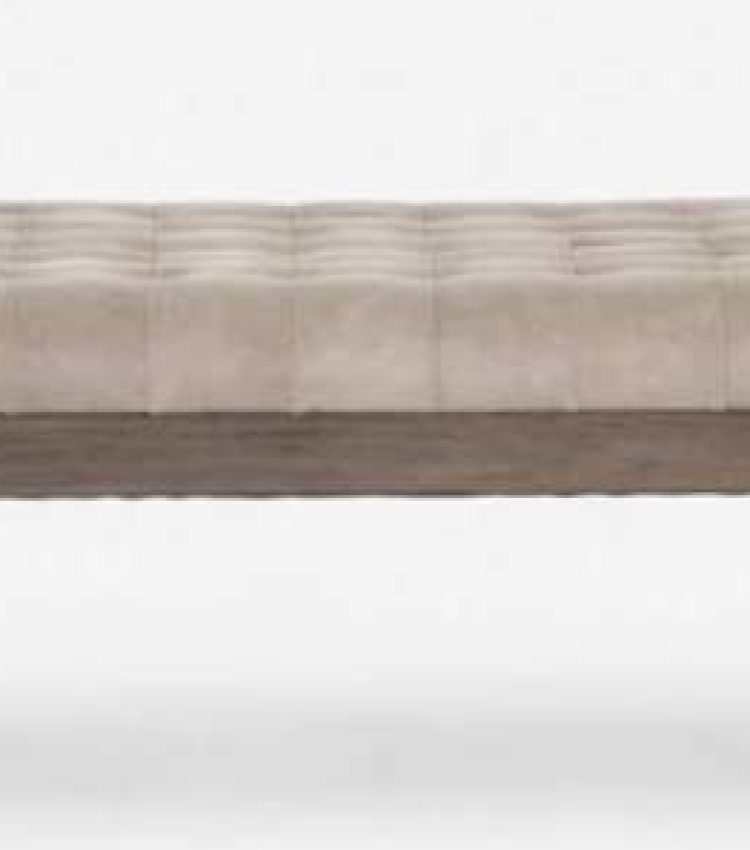 Barcelona daybed with wooden frame. tufted upholstery, and a secured bolster pillow