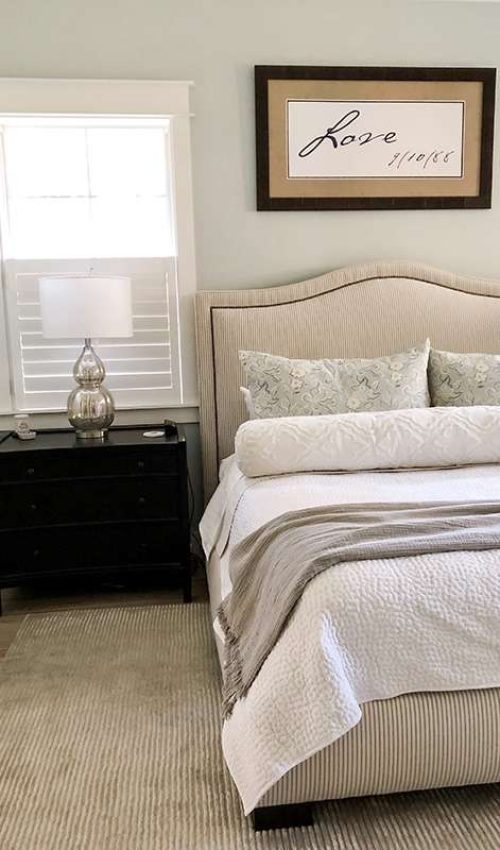 bed with 2 dutch pillows and a bolster one