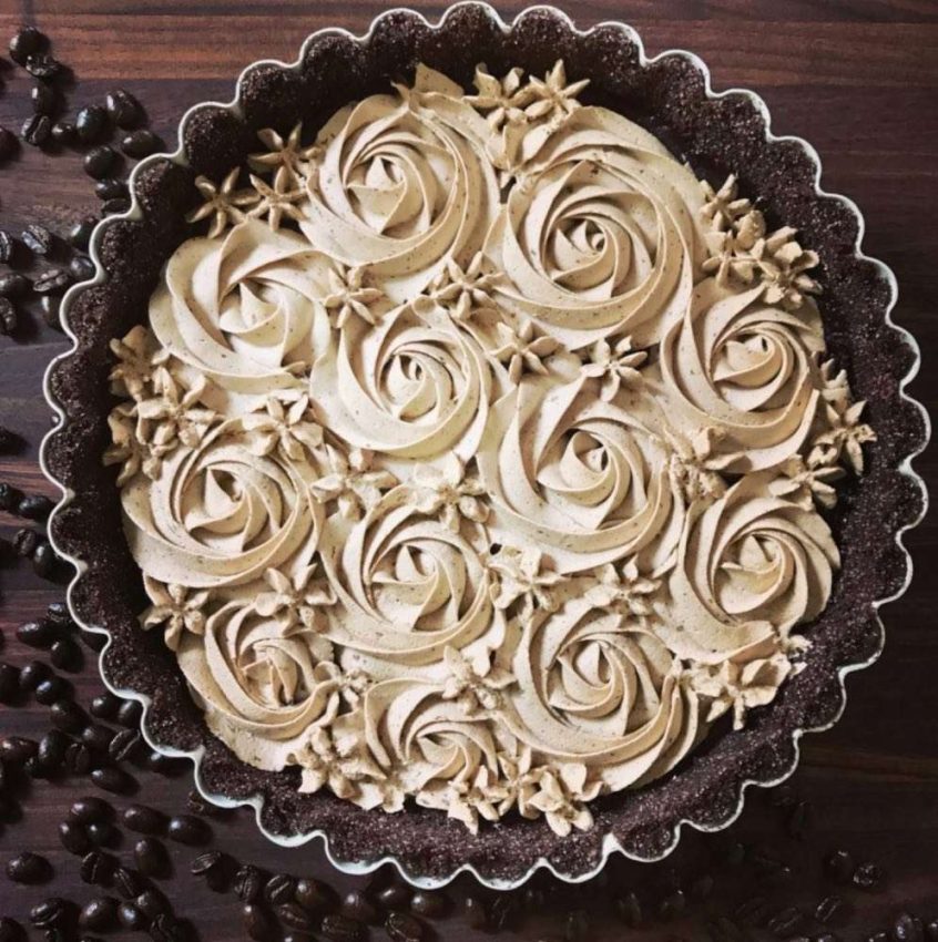 tarte pan filled with chocolate tart bottom and large rosettes of espresso cream.
