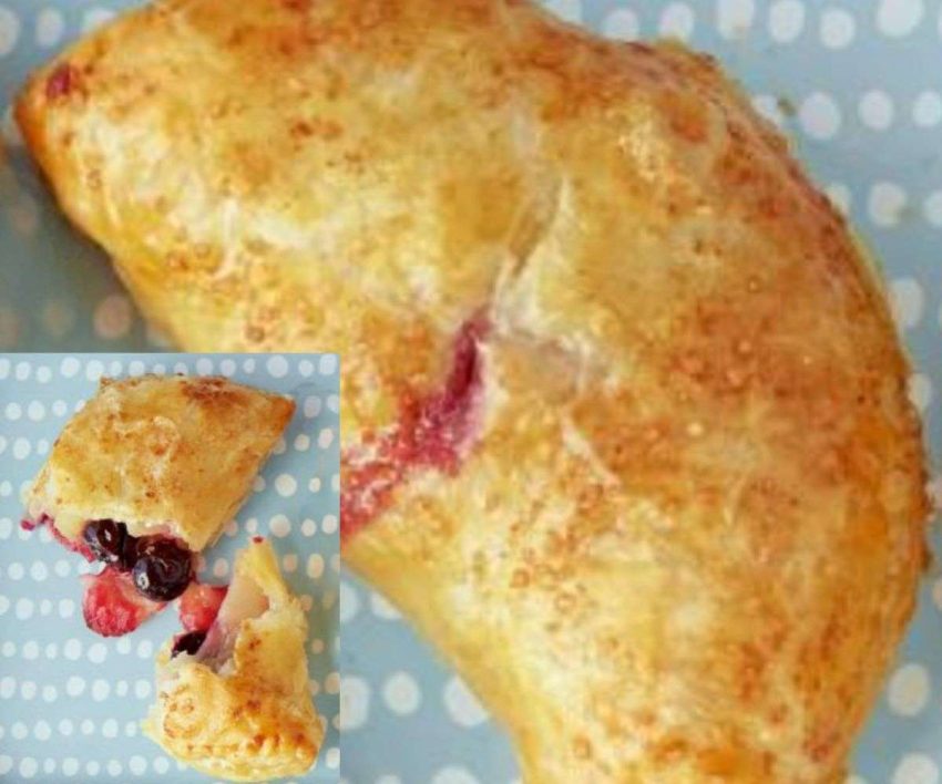 a hand pie with blueberries oozing out