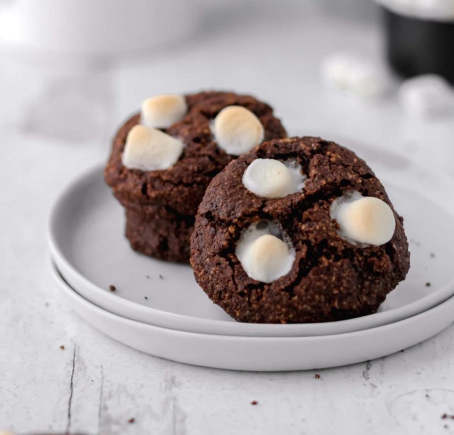 a plate with healthy chocolate cookies topped with mini marshmallows