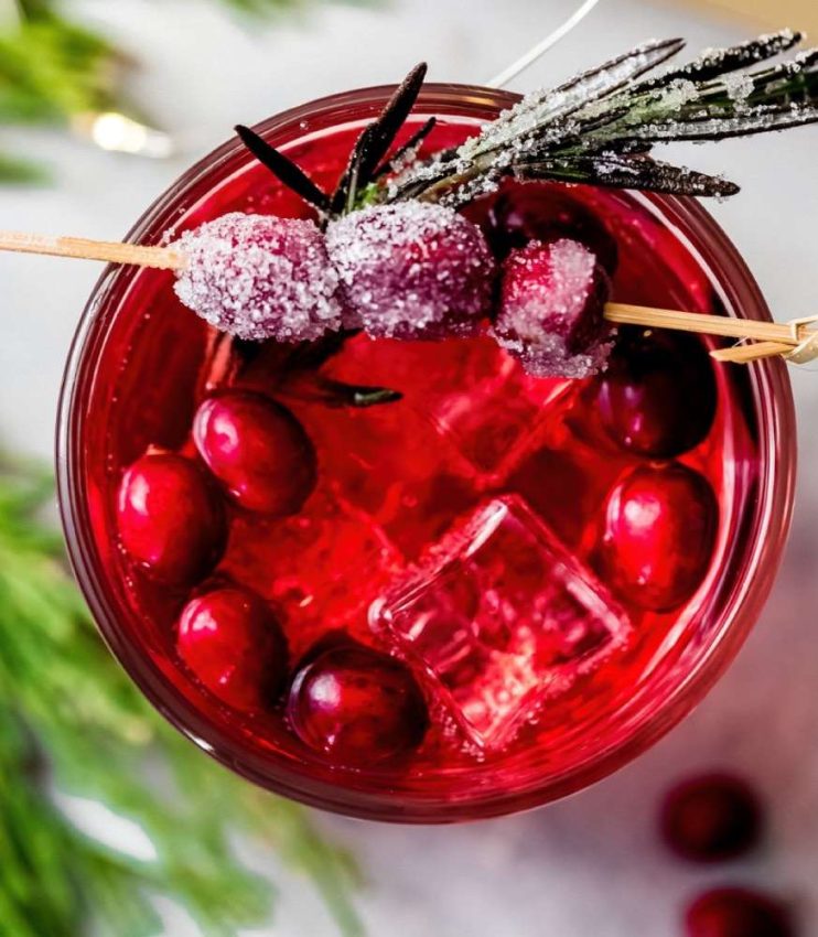Winter comfort food - La Croix vodka cranberry cocktail with sugared cranberries & rosemary sprig on a swizzle stick