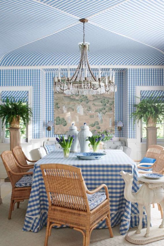 Dining room with blue and white check upholstered walls and ceiling