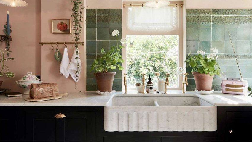 Vintage style kitchen with green tile backsplash and peach walls