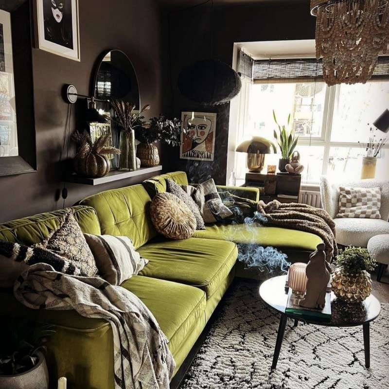 dark and moody brown living room with a bright lime green velvet sofa